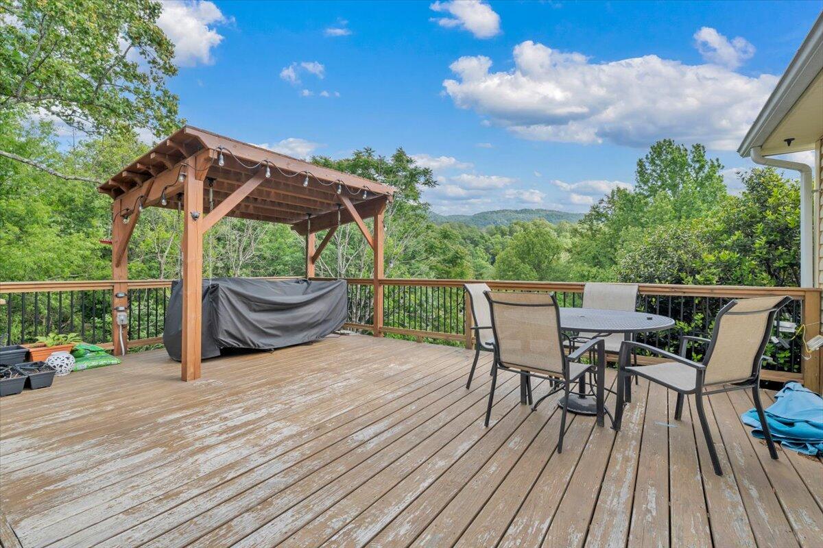 7851 Cedar Edge Road Roanoke, VA 24018 - Photo 32 of 44 a view of a deck with wooden floor and seating space