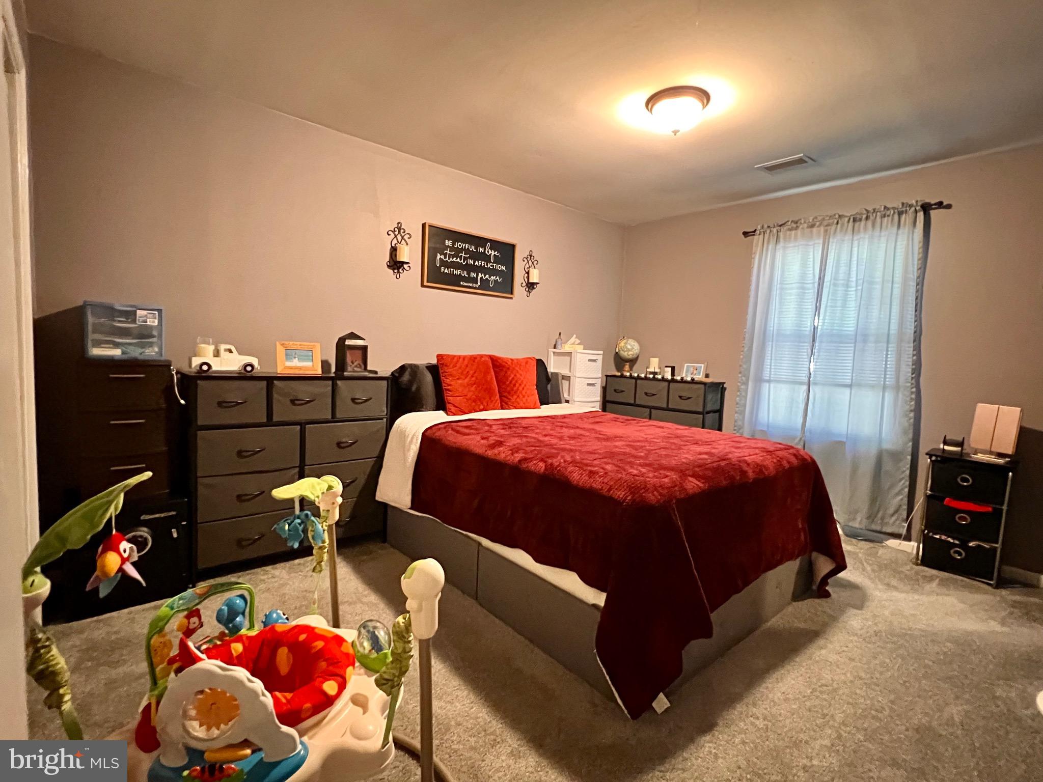111 Anderson Street Middletown, DE 19709 - Photo 25 of 48 a spacious bedroom with a bed and a tv