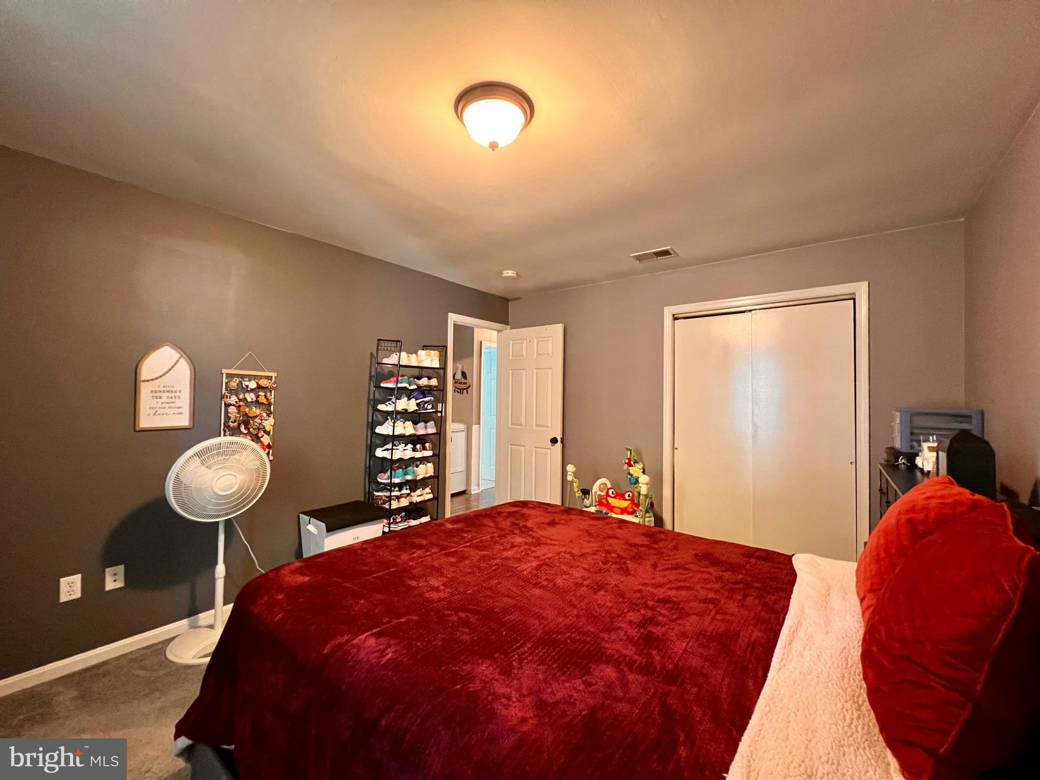 111 Anderson Street Middletown, DE 19709 - Photo 27 of 48 a bedroom with a bed and a chair