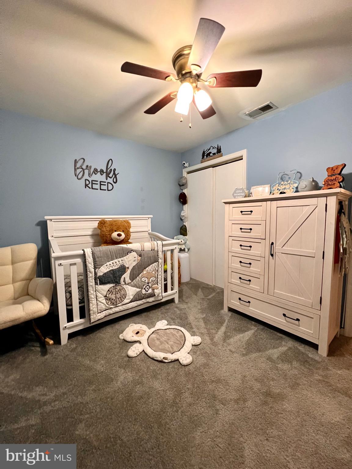 111 Anderson Street Middletown, DE 19709 - Photo 30 of 48 a utility room with a bed and a chandelier