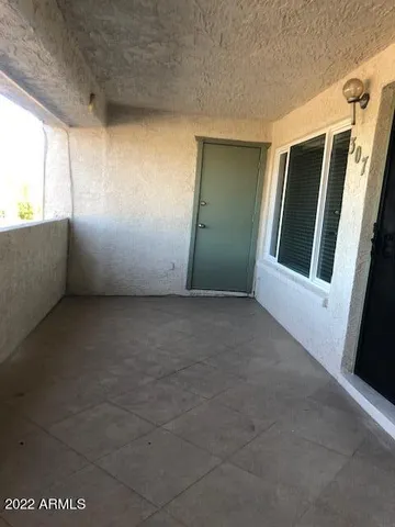 a view of an empty room with a window