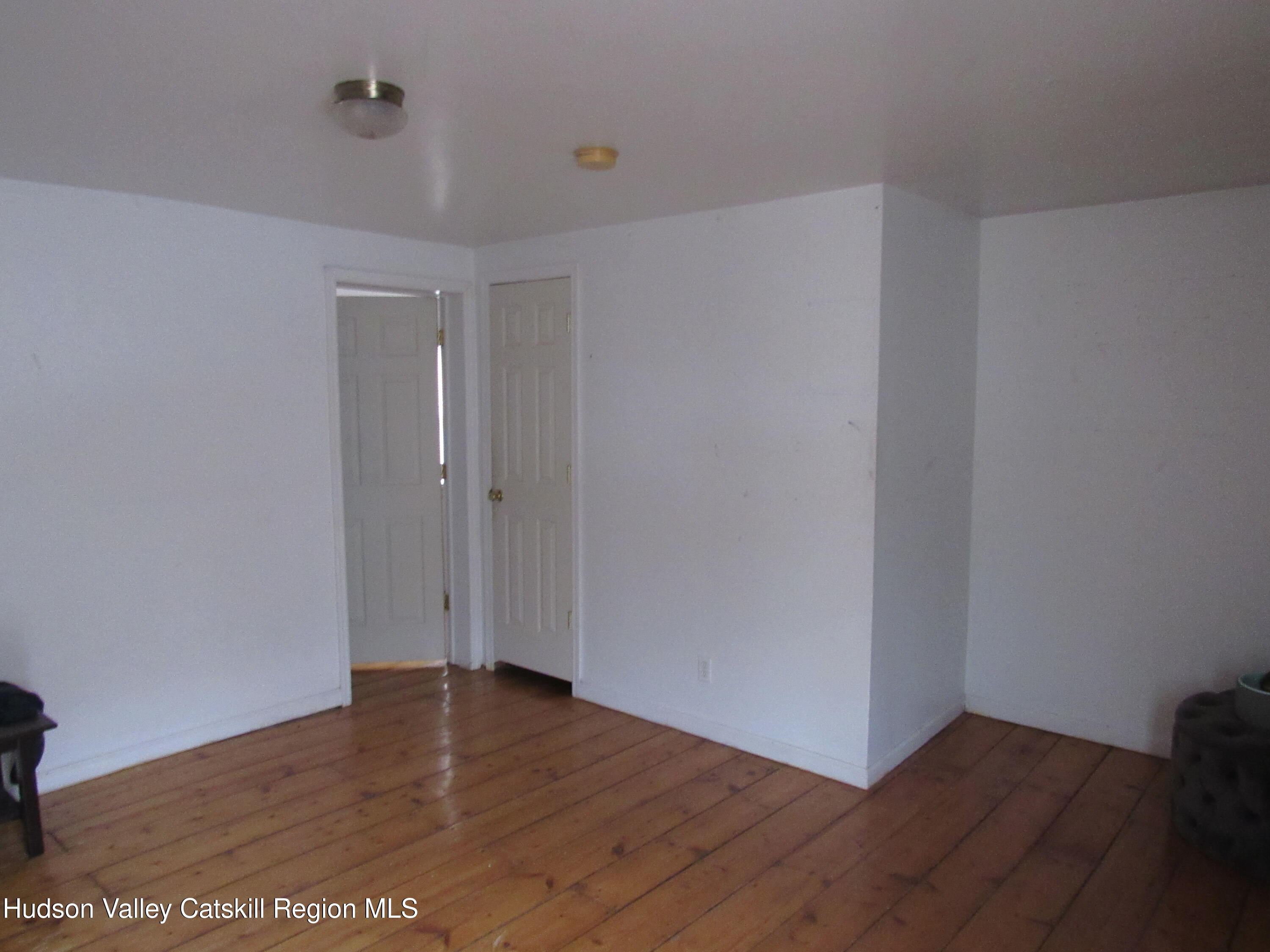 19 Old Post Road Esopus, NY 12493 - Photo 15 of 26 a view of an empty room with wooden floor