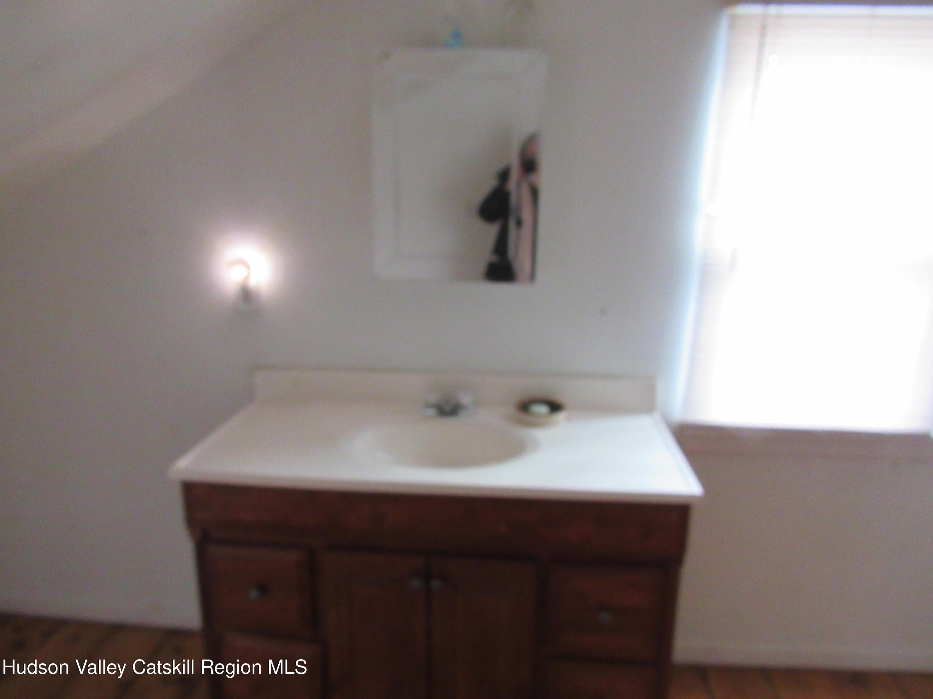 19 Old Post Road Esopus, NY 12493 - Photo 17 of 26 a bathroom with a sink and a mirror