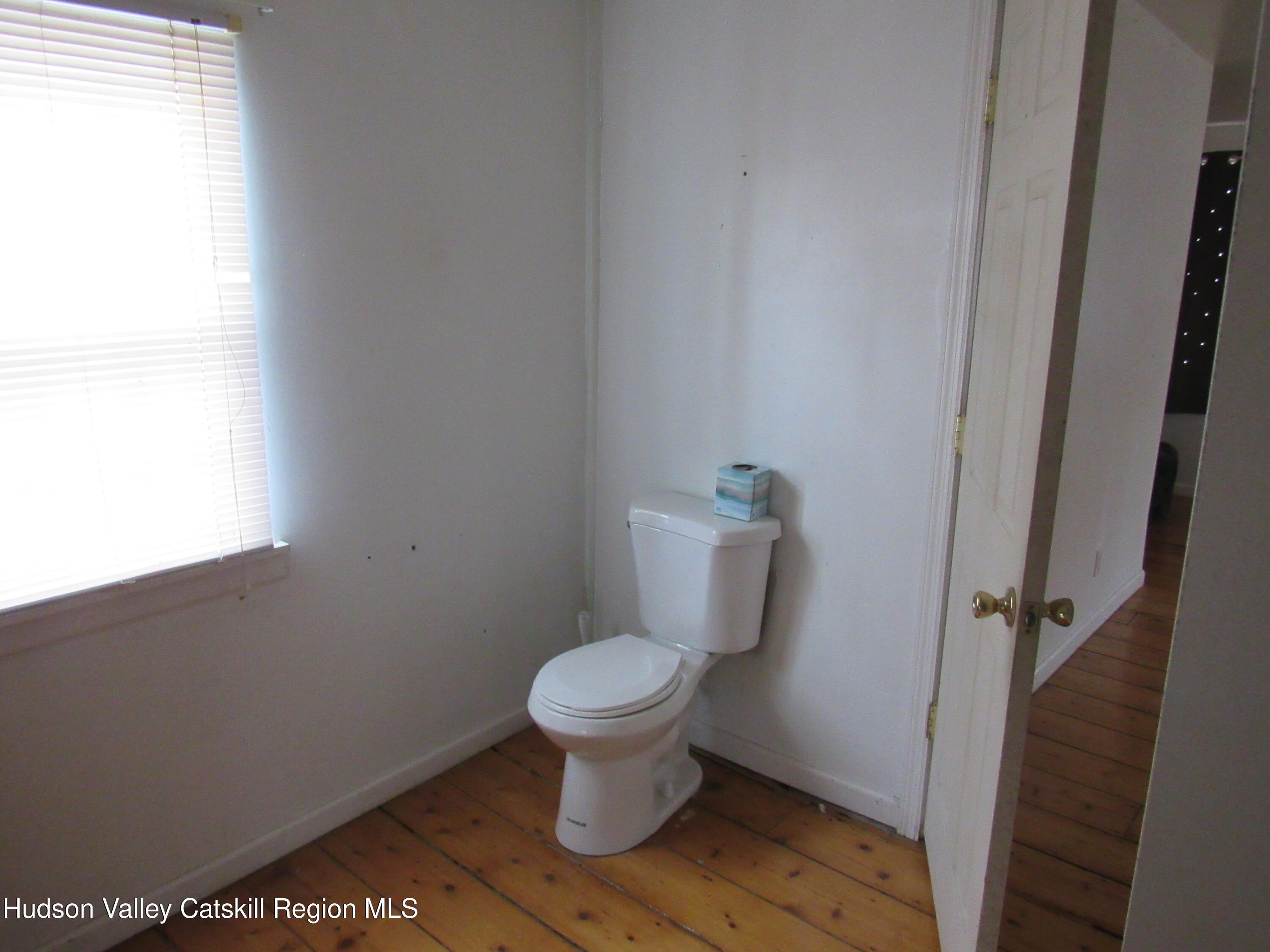 19 Old Post Road Esopus, NY 12493 - Photo 18 of 26 a bathroom with a toilet and a window