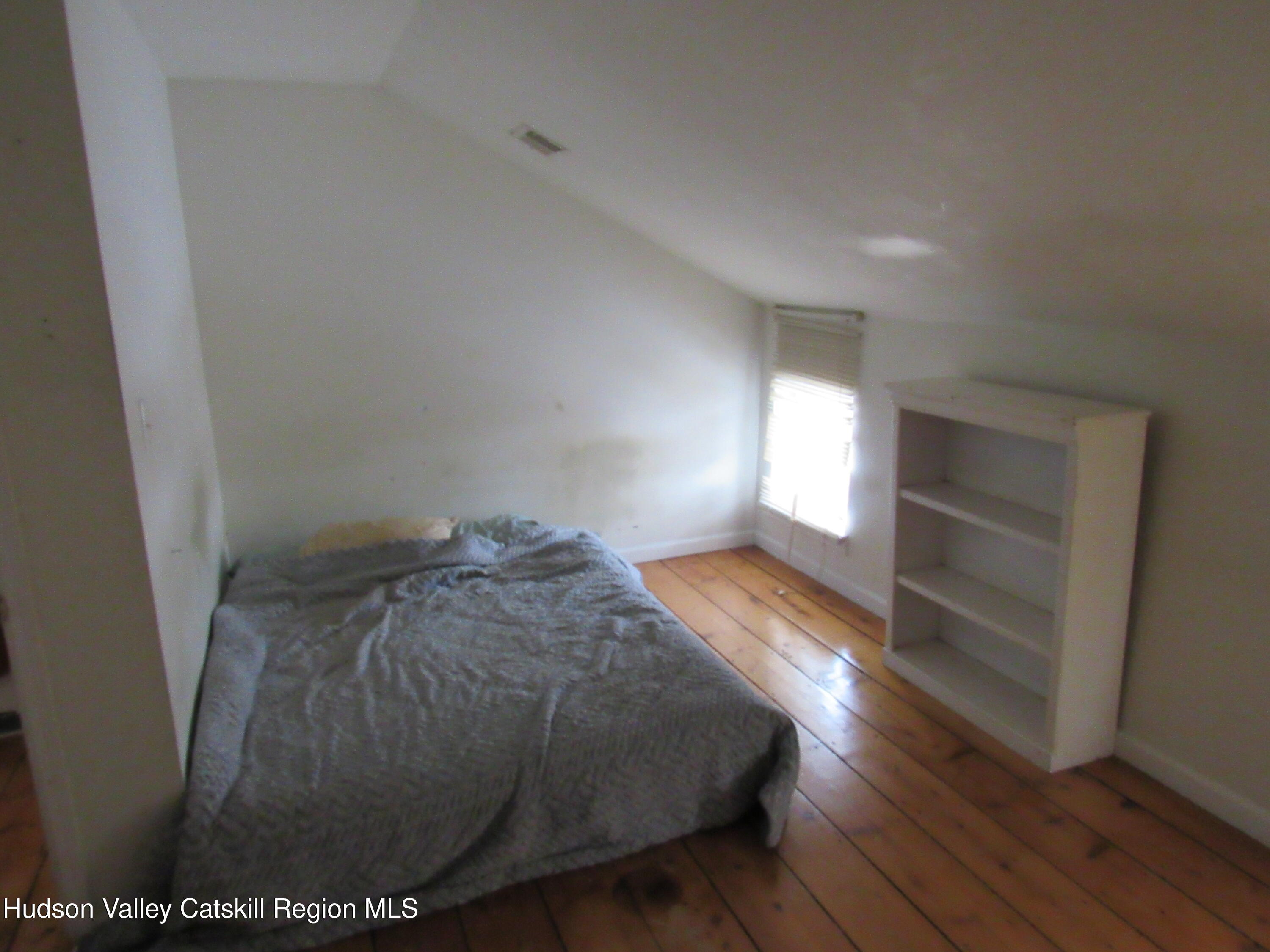 19 Old Post Road Esopus, NY 12493 - Photo 20 of 26 a view of empty room with wooden floor