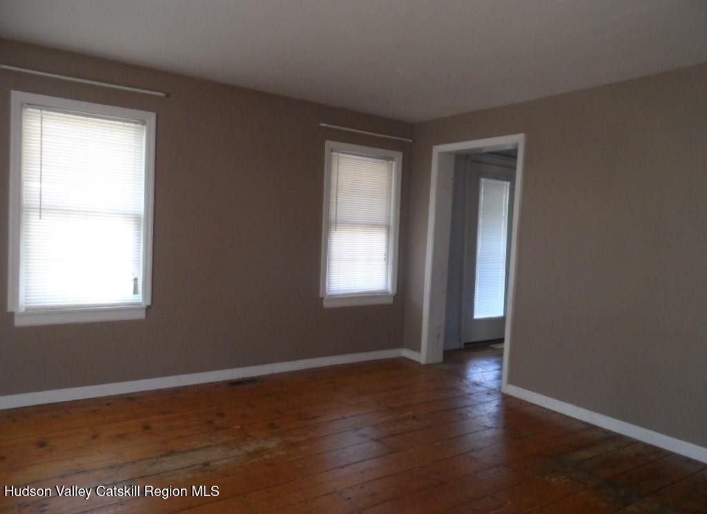 19 Old Post Road Esopus, NY 12493 - Photo 8 of 26 a view of an empty room with wooden floor and a window