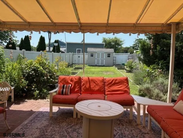 a view of a chairs and table in the patio