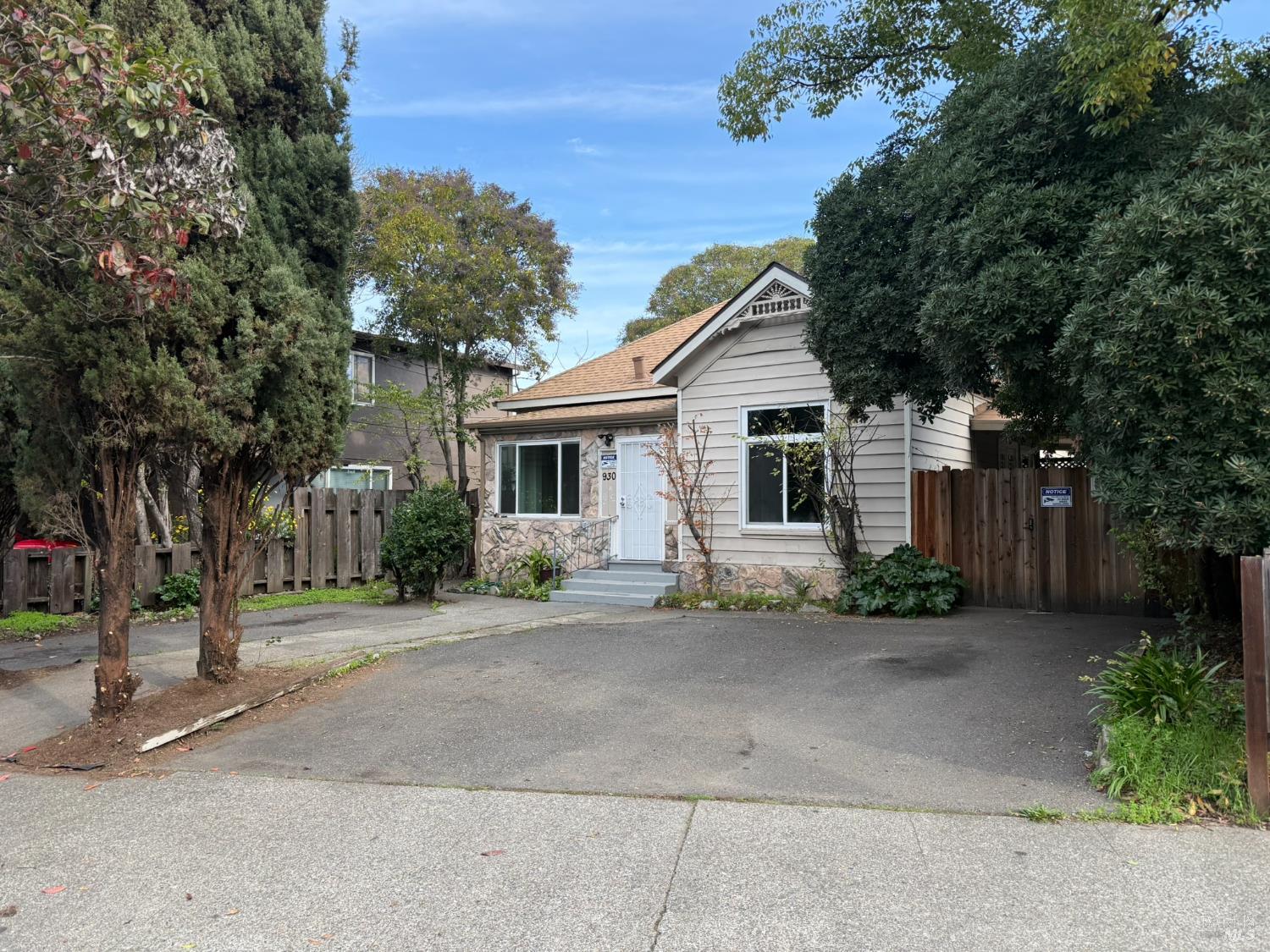 930 Morgan Street, Unit 3 Santa Rosa, CA 95401 - Photo 1 of 53 a front view of a house with a yard