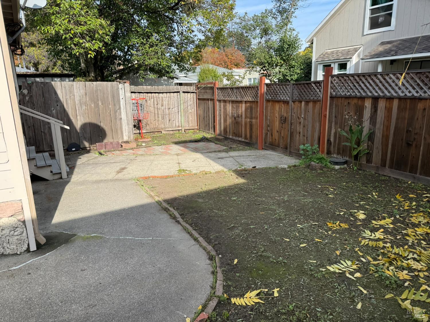 930 Morgan Street, Unit 3 Santa Rosa, CA 95401 - Photo 14 of 53 a view of a backyard with wooden fence