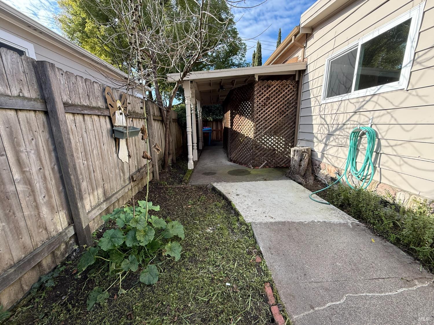 930 Morgan Street, Unit 3 Santa Rosa, CA 95401 - Photo 17 of 53 a view of a house with a backyard and wooden fence