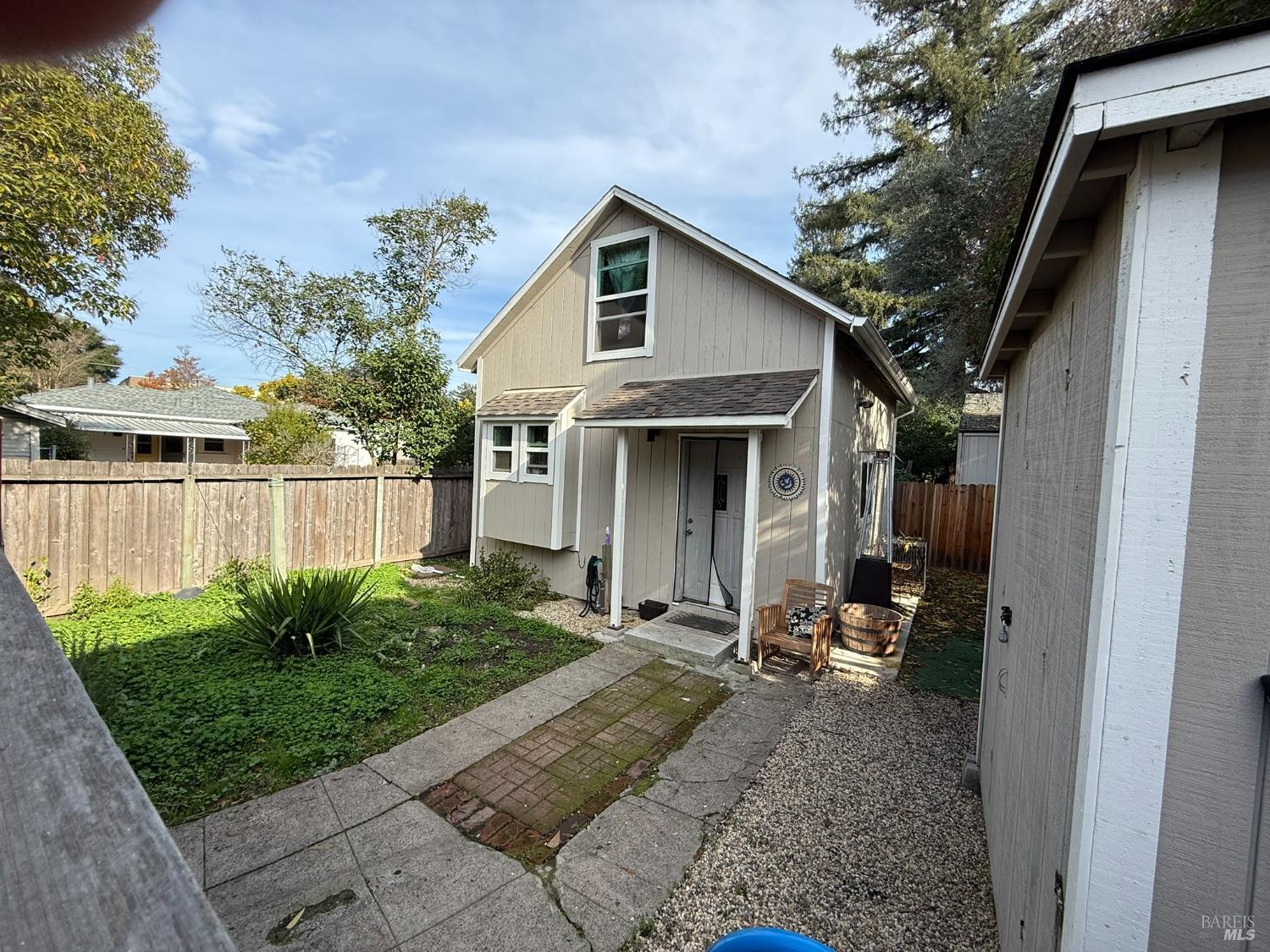 930 Morgan Street, Unit 3 Santa Rosa, CA 95401 - Photo 21 of 53 a view of a small garden in front of a house with plants