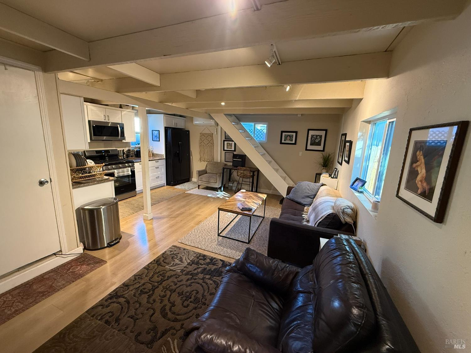 930 Morgan Street, Unit 3 Santa Rosa, CA 95401 - Photo 23 of 53 a living room with furniture and a flat screen tv