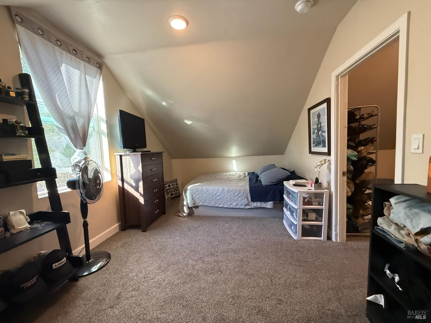 930 Morgan Street, Unit 3 Santa Rosa, CA 95401 - Photo 28 of 53 a living room with furniture and a flat screen tv