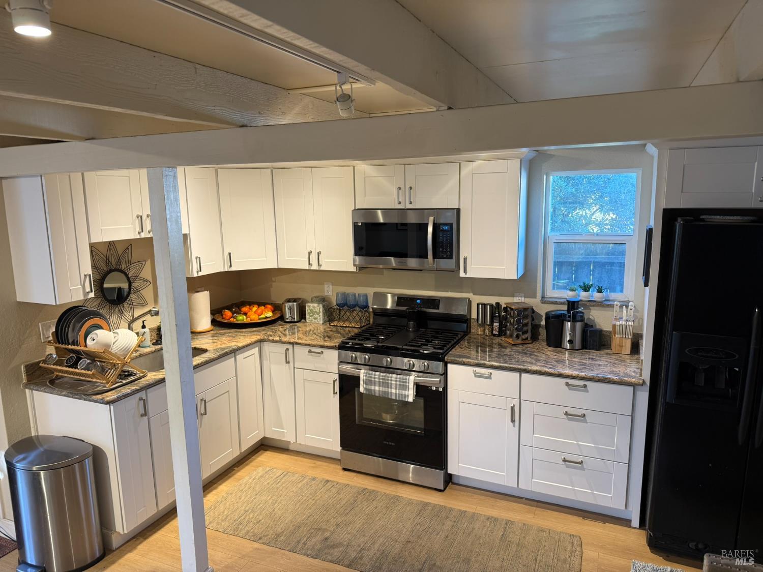 930 Morgan Street, Unit 3 Santa Rosa, CA 95401 - Photo 35 of 53 a kitchen with a sink stove and refrigerator
