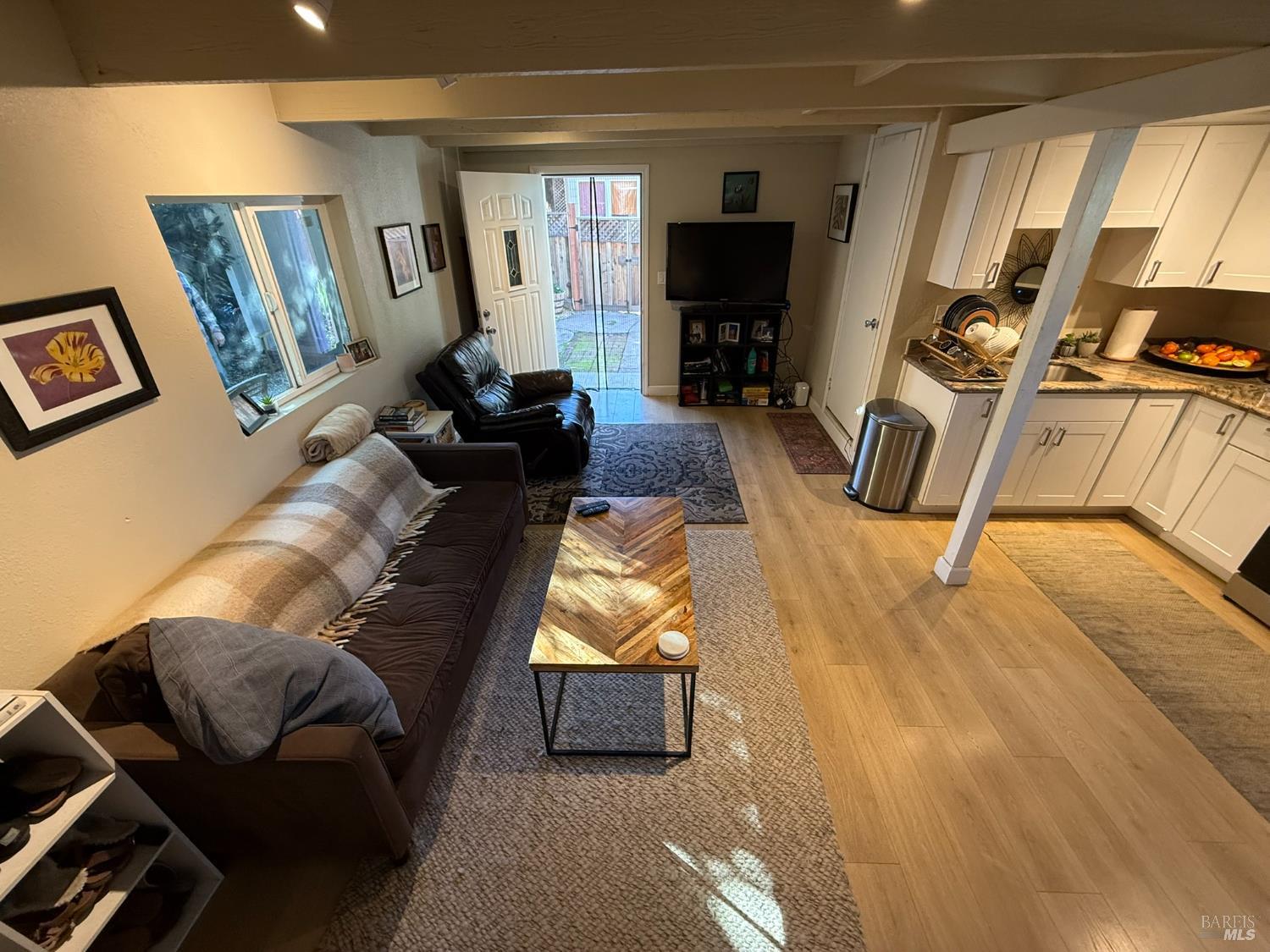 930 Morgan Street, Unit 3 Santa Rosa, CA 95401 - Photo 37 of 53 a living room with furniture and a flat screen tv