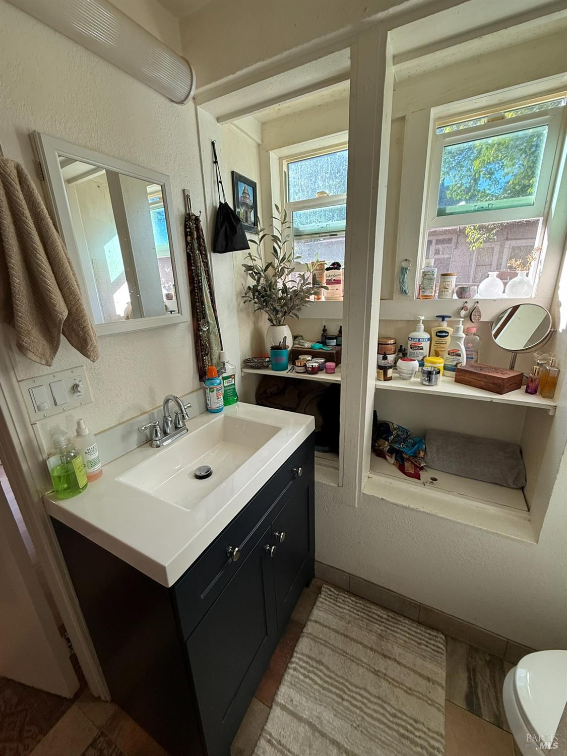 930 Morgan Street, Unit 3 Santa Rosa, CA 95401 - Photo 39 of 53 a bathroom with a sink double vanity and a mirror