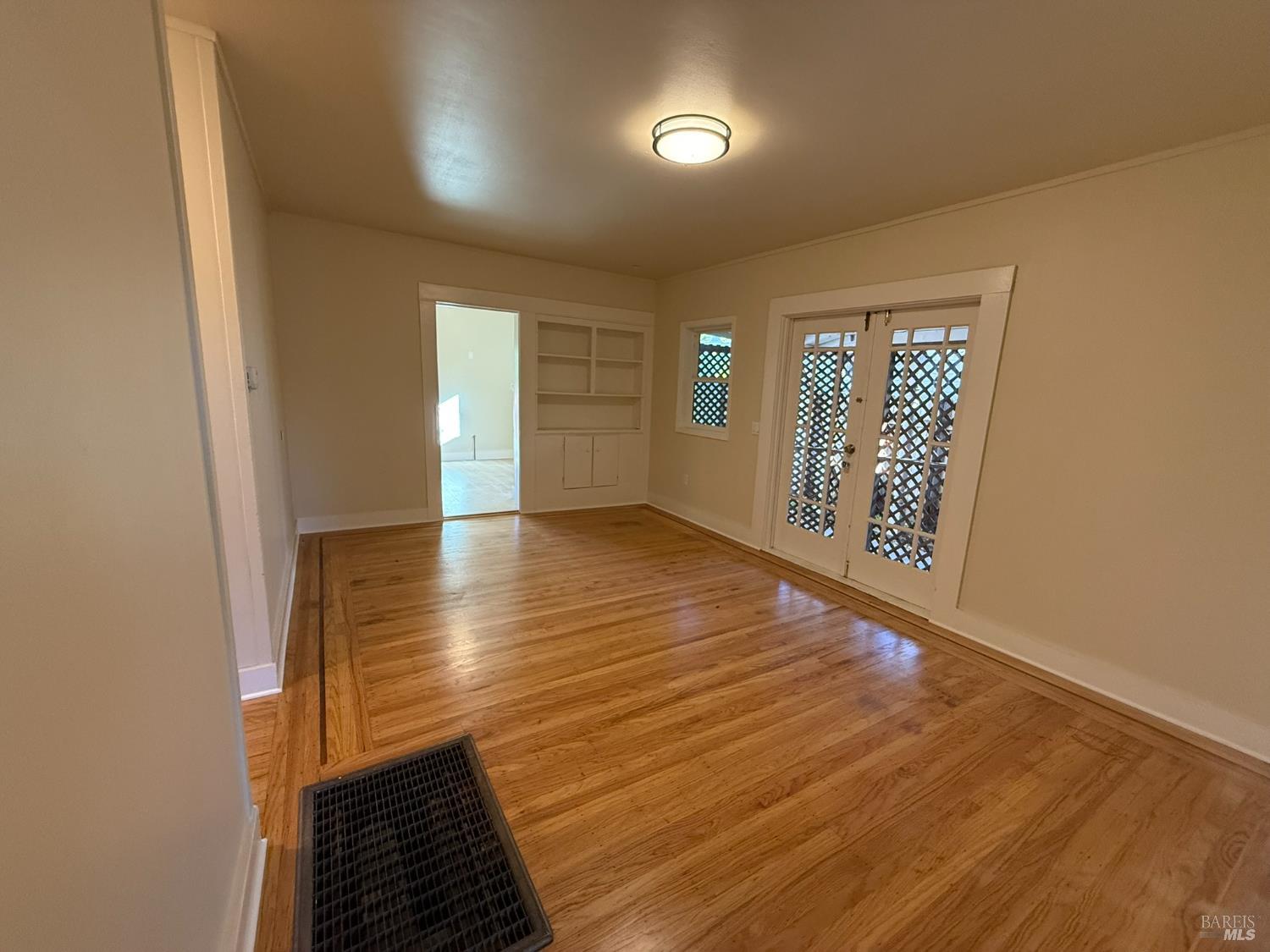 930 Morgan Street, Unit 3 Santa Rosa, CA 95401 - Photo 4 of 53 wooden floor in an empty room with a window