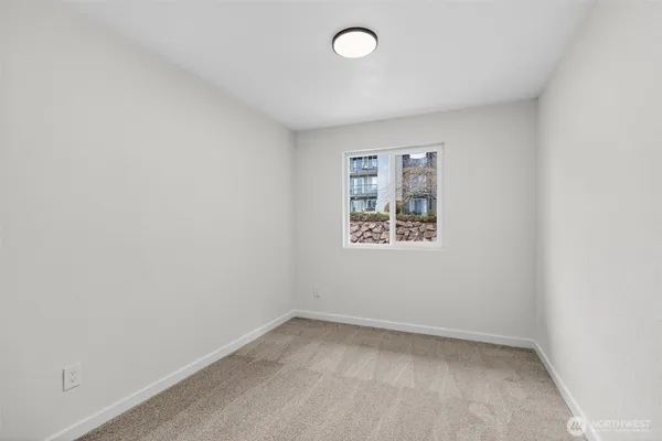 an empty room with a empty space and window