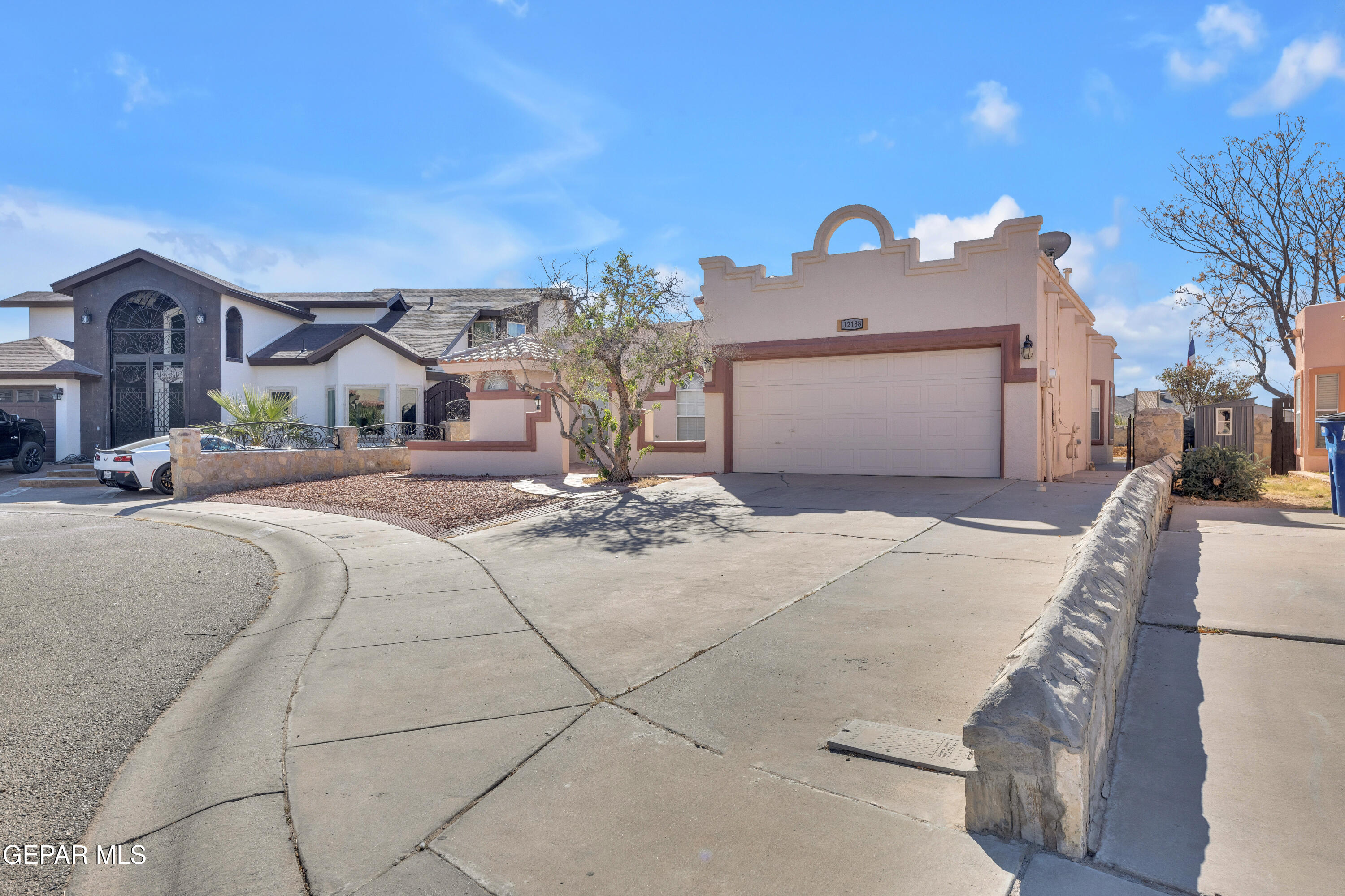 12188 Dos Rios Drive El Paso, TX 79936 - Photo 1 of 1 a front view of a house with a yard and garage