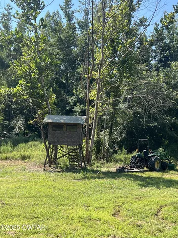 a view of a table and chairs in the garden