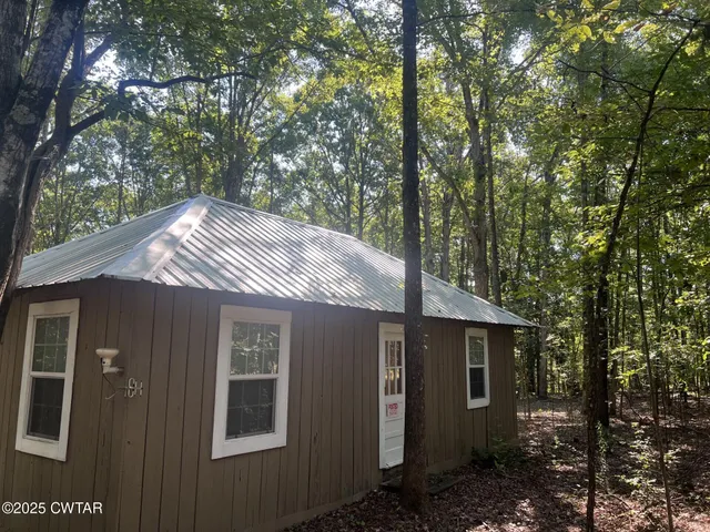 a view of a house with a tree