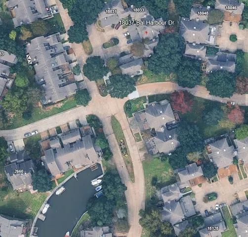 a bathroom with a toilet a sink and a mirror