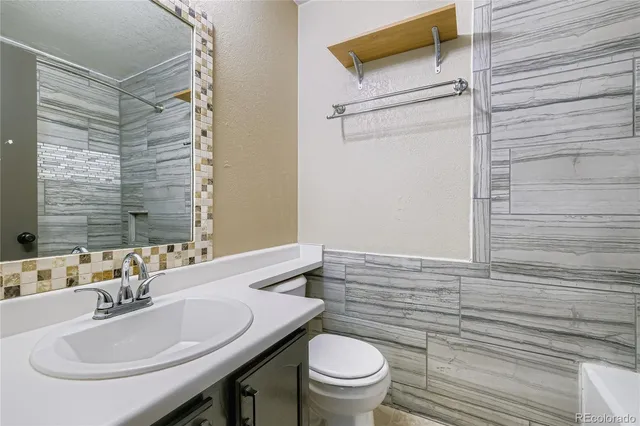 a bathroom with a sink and a toilet