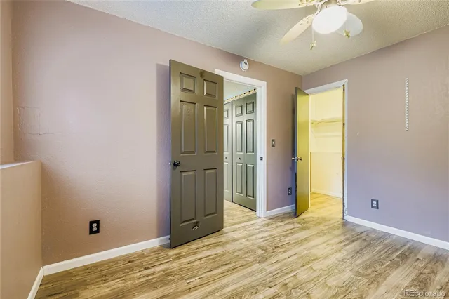 a view of a livingroom with wooden floor and closet