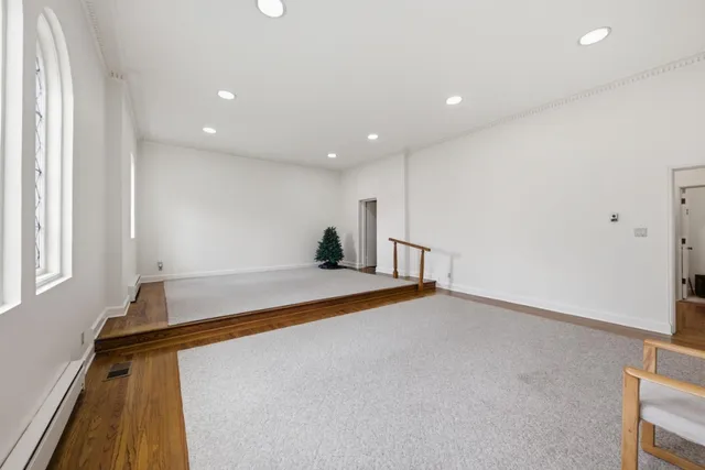a en suite bathroom with a granite countertop sink and mirror