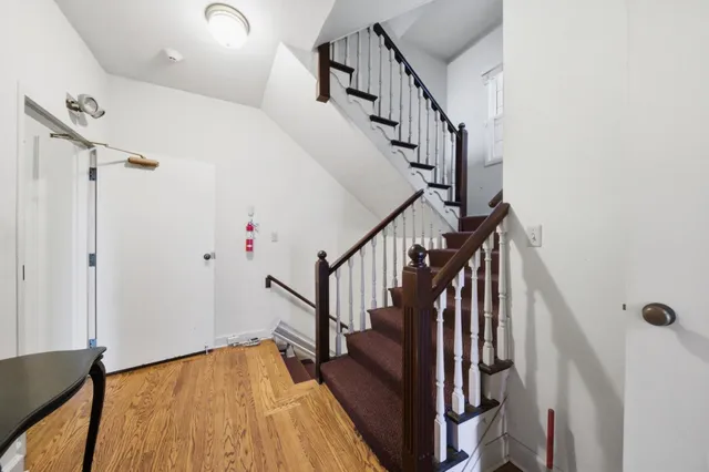 a living room with furniture chess board and a couch