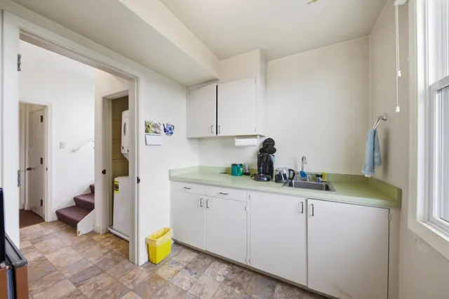 a bedroom with furniture and a window