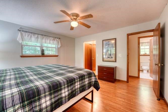 3333 Ellington Road Hayesville, NC 28904 - Photo 40 of 56 a bedroom with a large bed and a window