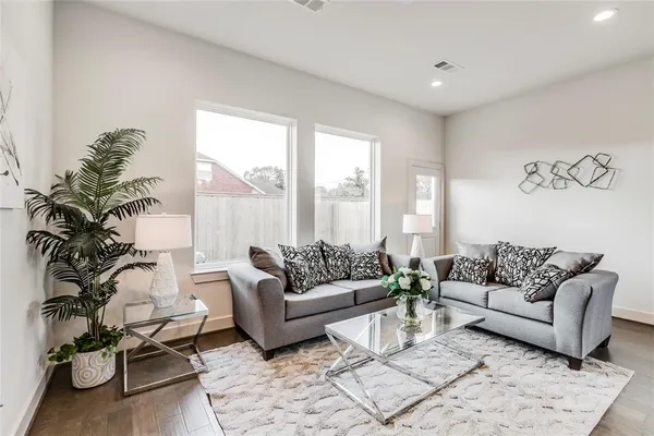 a living room with furniture and a large window