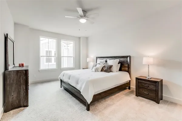 a bedroom with a bed and a tv