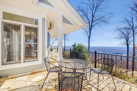a view of a balcony with chairs
