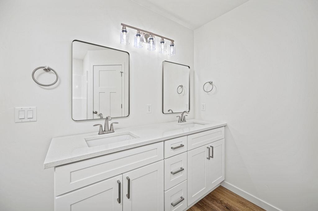 164 Orchard View Way Grand Junction, CO 81503 - Photo 18 of 24 a bathroom with a double vanity sink and mirror