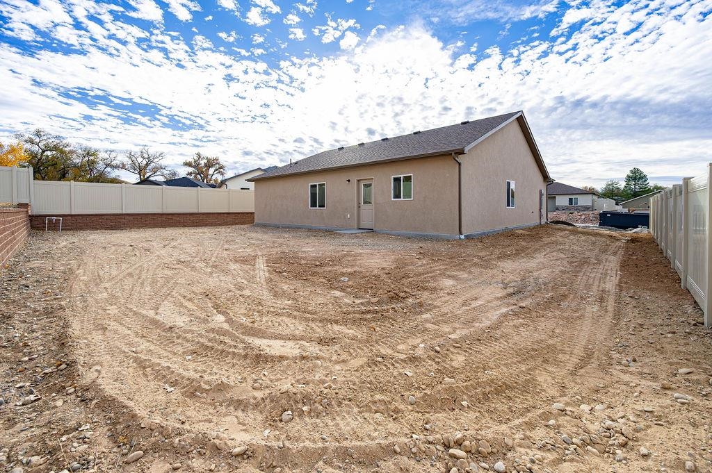 164 Orchard View Way Grand Junction, CO 81503 - Photo 5 of 24 a backyard of a house with lots of green space