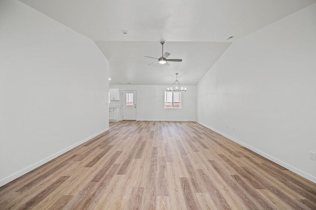 164 Orchard View Way Grand Junction, CO 81503 - Photo 7 of 24 wooden floor in an empty room with a window