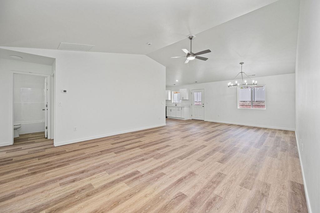 164 Orchard View Way Grand Junction, CO 81503 - Photo 9 of 24 a view of empty room with wooden floor and ceiling fan