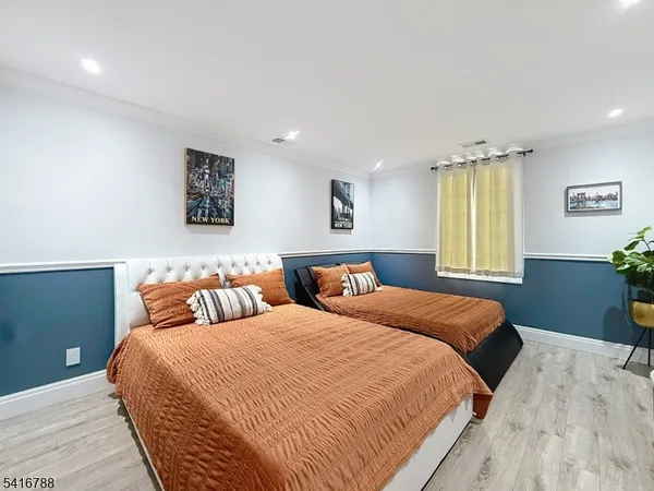 a living room with a bed and a window