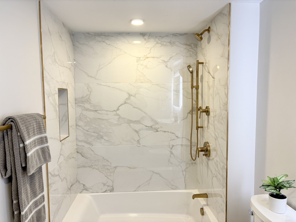 421 High Street, Unit 203 Medford, MA 02155 - Photo 12 of 19 a bathroom with a shower and a sink