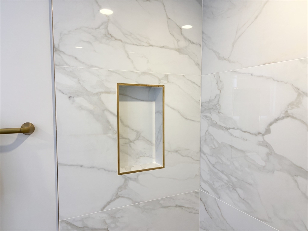 421 High Street, Unit 203 Medford, MA 02155 - Photo 14 of 19 a bathroom with a shower