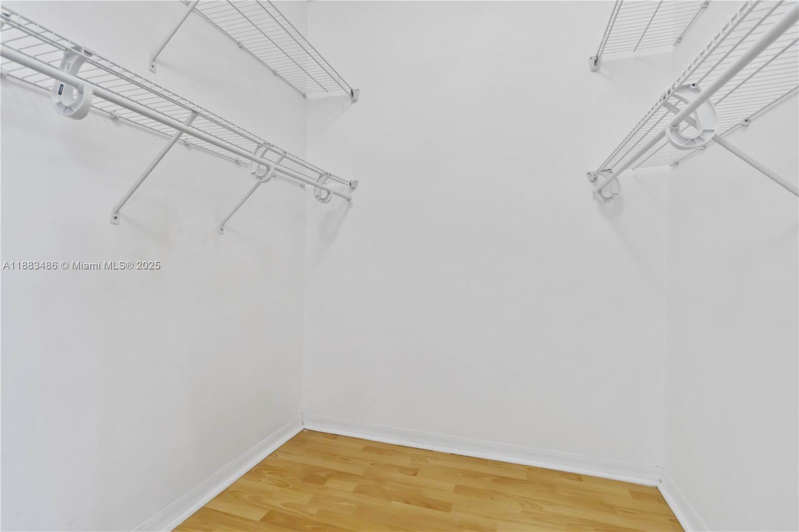 8431 Northwest 188th Terrace, Unit 8058 Hialeah, FL 33015 - Photo 28 of 34 a view of a room with racks on the wall