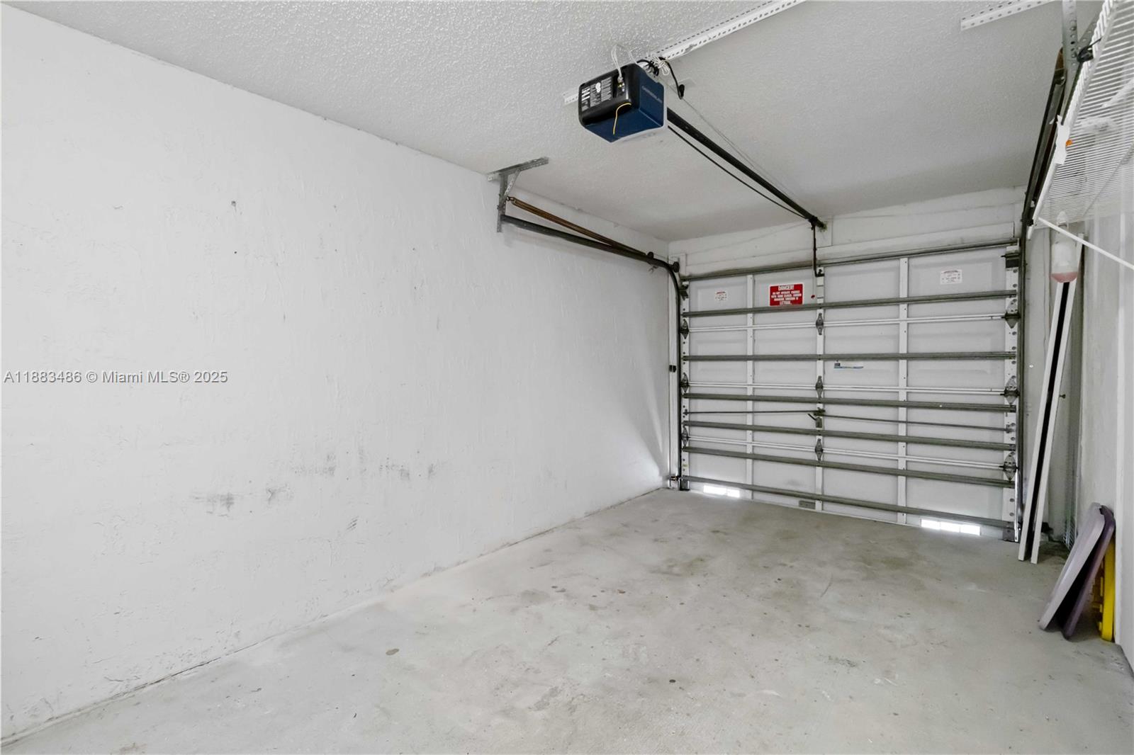 8431 Northwest 188th Terrace, Unit 8058 Hialeah, FL 33015 - Photo 30 of 34 a view of a room with an empty space