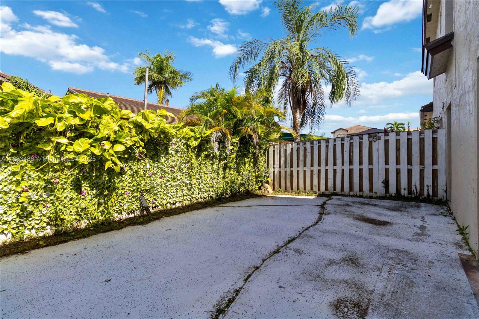 8431 Northwest 188th Terrace, Unit 8058 Hialeah, FL 33015 - Photo 33 of 34 a view of a garden