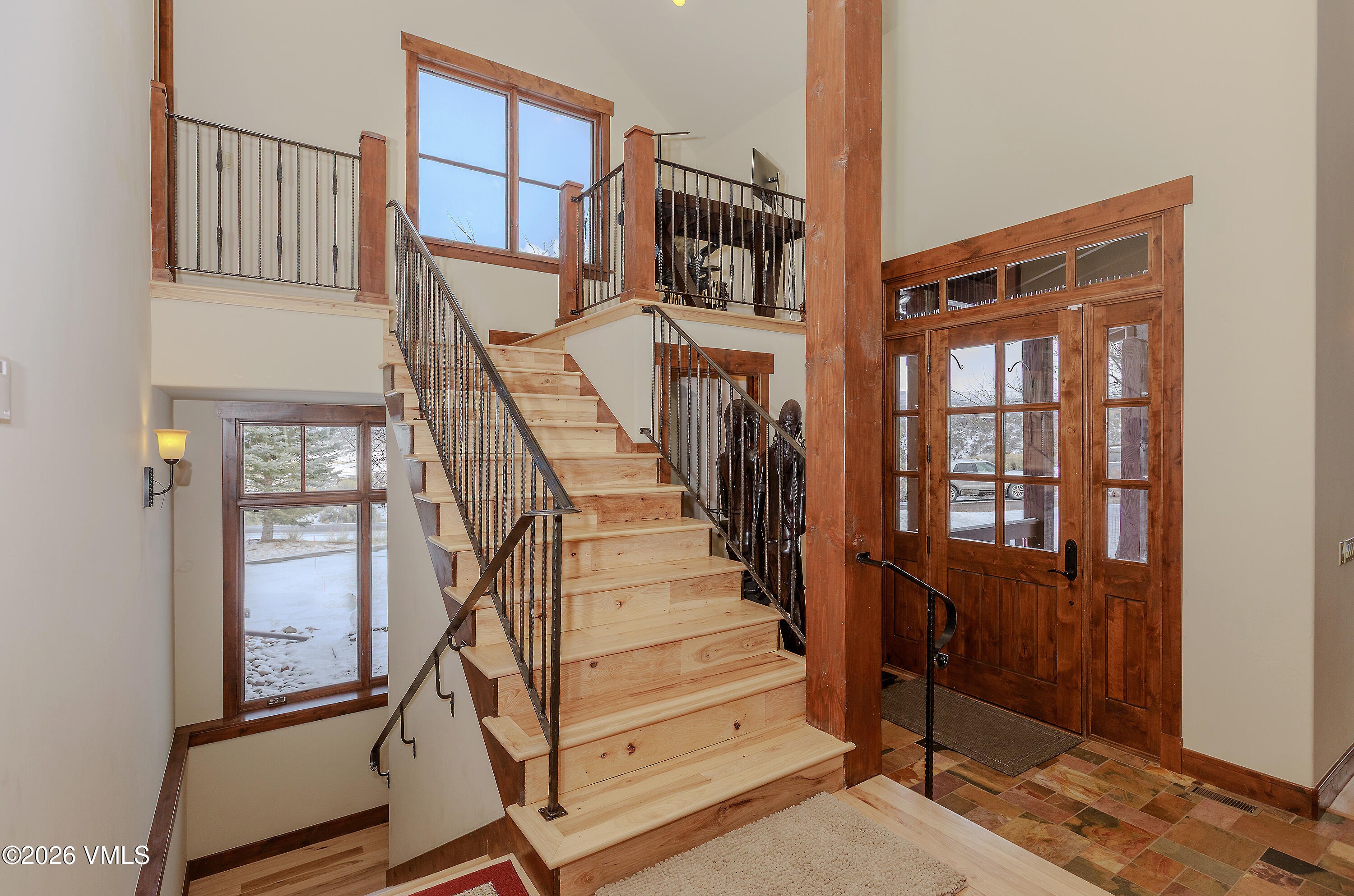 2753 East Haystacker Drive Eagle, CO 81631 - Photo 16 of 41 a view of staircase with lots of frames on wall and a window