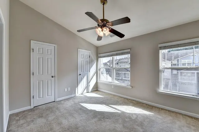 a view of entryway and hall with a large window