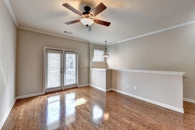 a view of a room with wooden cabinets