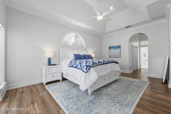 a view of a patio with couches and a potted plant on a table