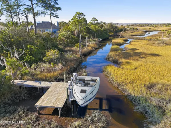 a kitchen with stainless steel appliances kitchen island granite countertop a dining table chairs and view living room